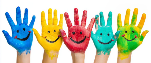 image of hands painted in bright colors with smiling faces on them